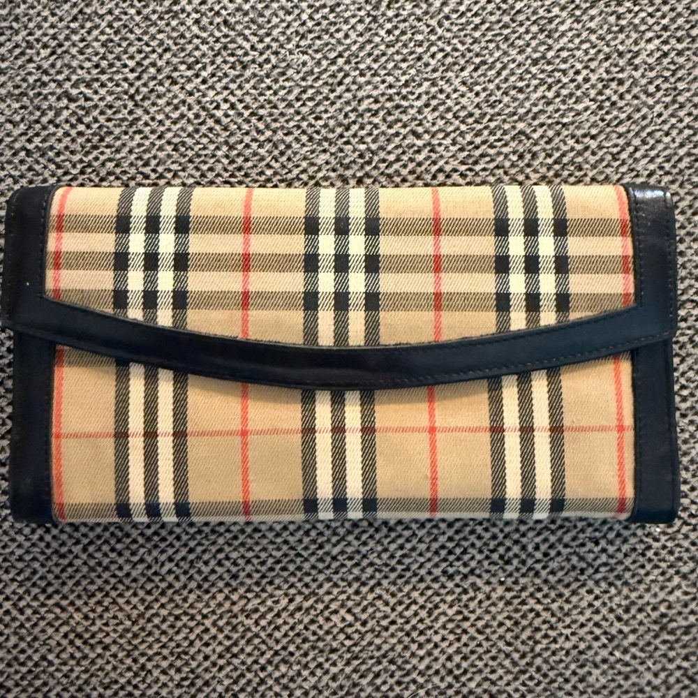 Burberrys Black Leather Wallet and checkbook. Checkbook has cut along the top
